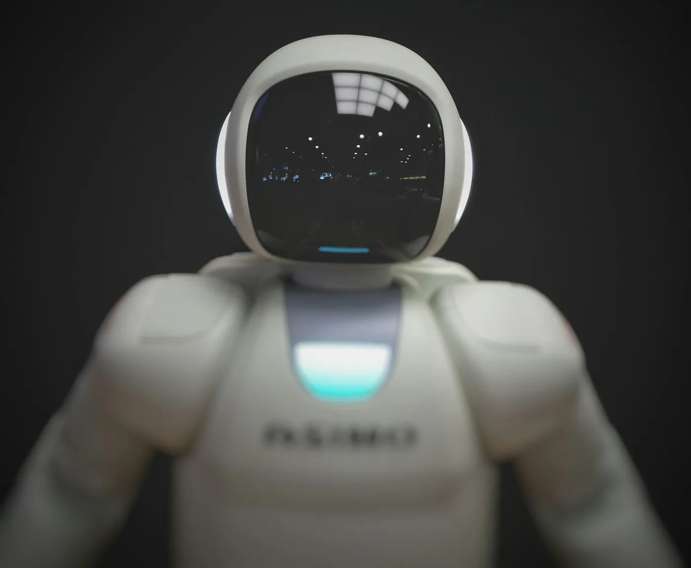 Humanoid robot against a dark background
