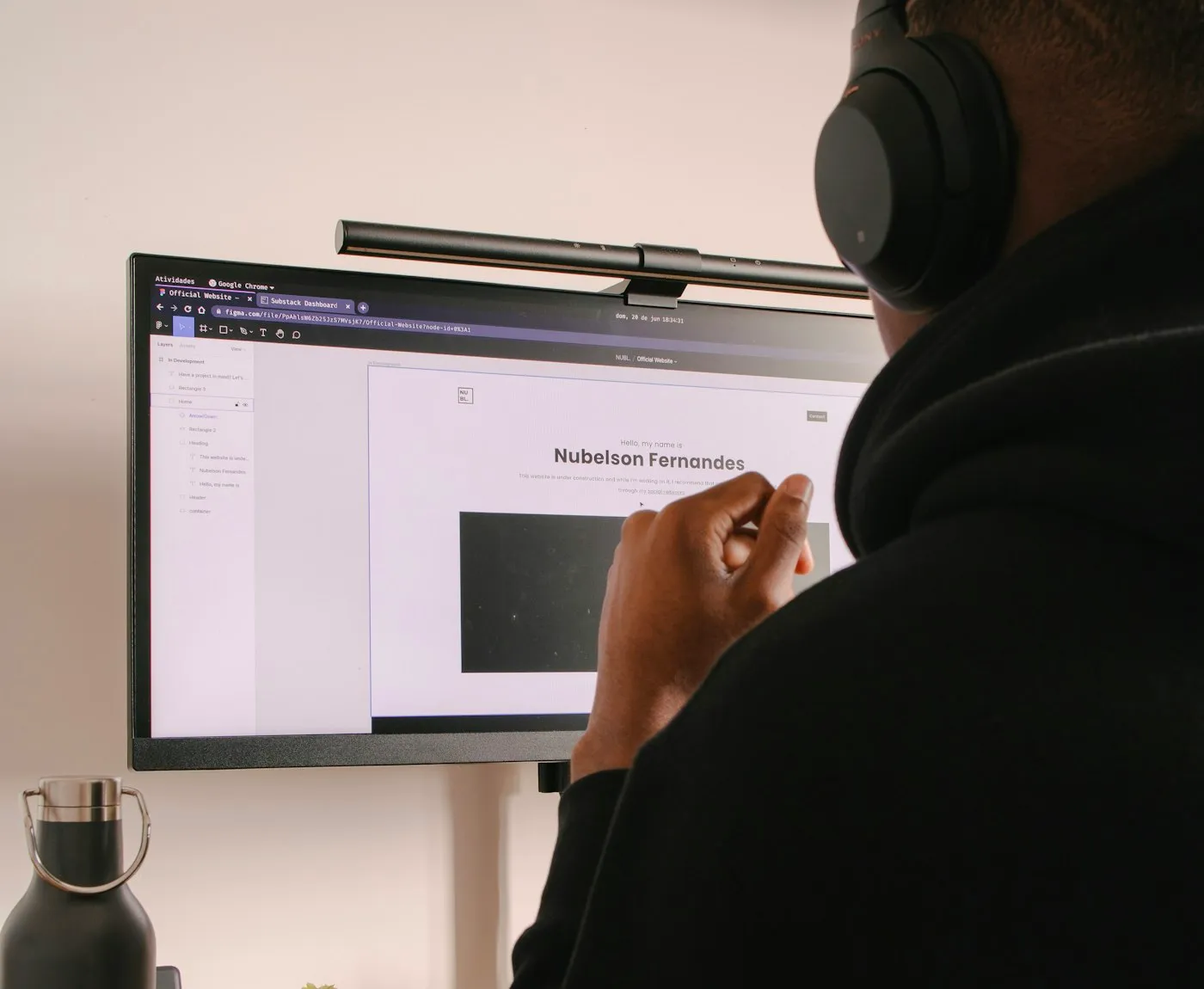 Designer working on an interface at a large monitor