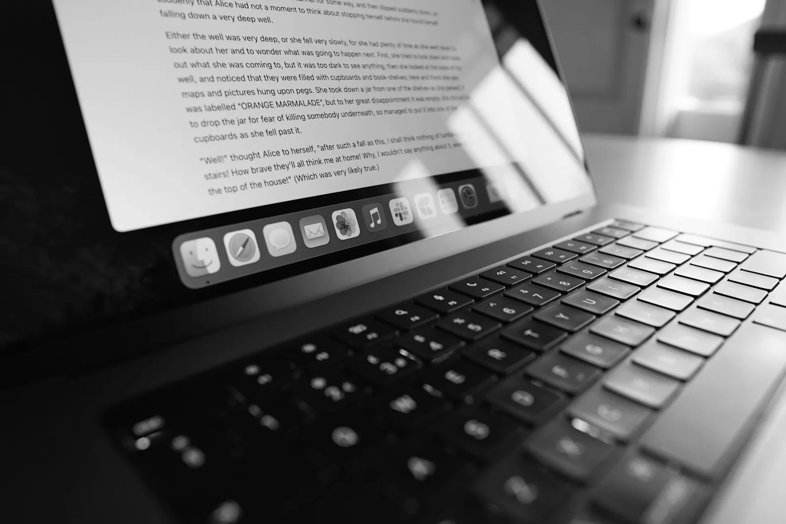 A laptop screen showing a long text document