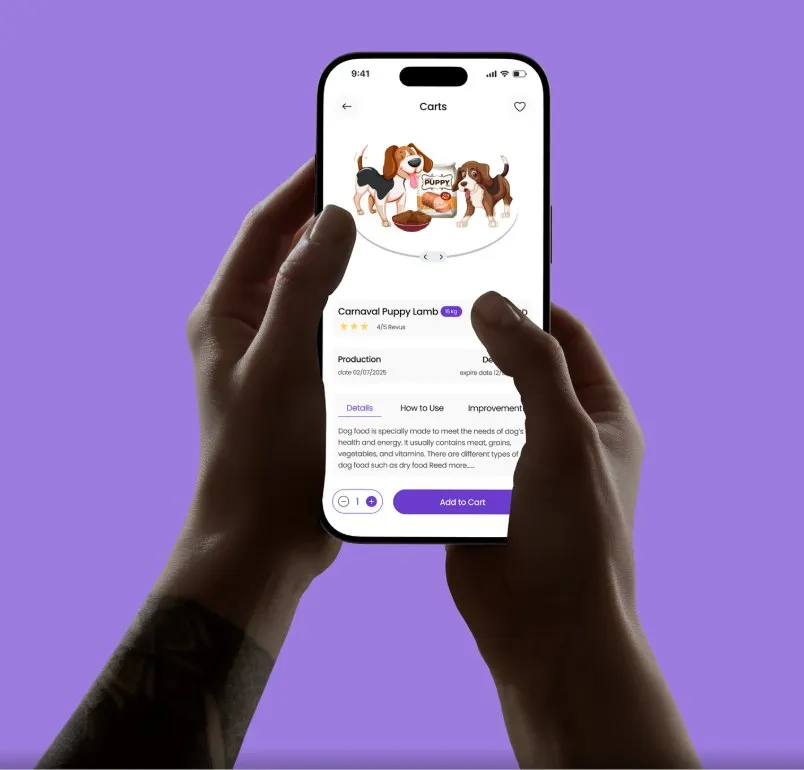 Two hands holding a phone showing the Carnaval Puppy Lamb product page with details tabs and an Add to Cart button
