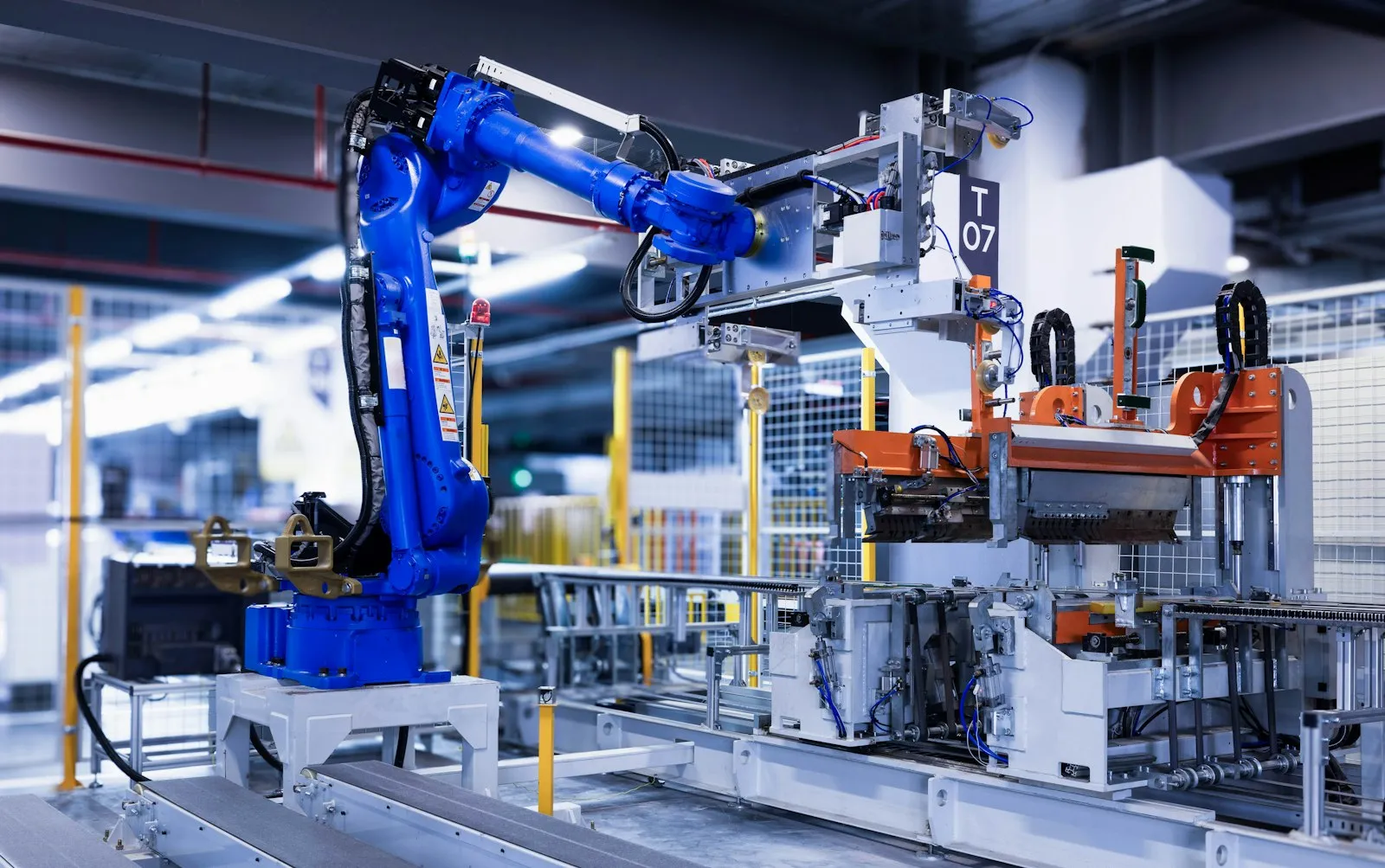 An industrial robot arm working on a factory production line